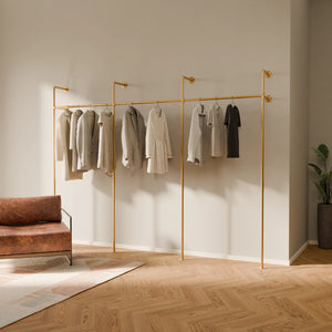 Gold hanging clothes rail system